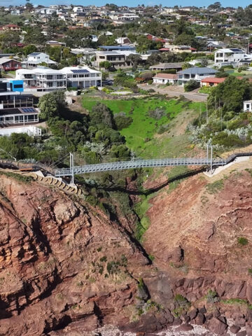 New suspension bridge opened August 2024, crossing Grey Gully